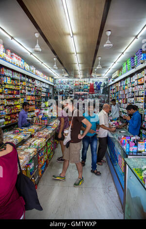 MUMBAI, INDIA - OCTOBER 9, 2015: Unidentified people in the shop  in Mumbai, India. With 12 million people, Mumbai is the most p Stock Photo