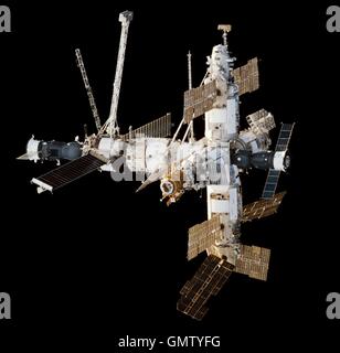 View of the Russian Mir Space Station against black space as from Space Shuttle Endeavour during the STS-89 rendezvous and docking February 9, 1998 in Earth Orbit. A Progress cargo ship is attached on the left, a Soyuz manned spacecraft attached on the right. Stock Photo