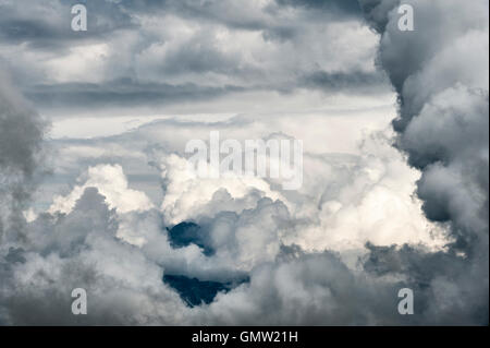 The Dolomites, Trentino, Italy. Approaching storm - a dramatic cloudscape seen from the mountain refuge at Passo delle Selle Stock Photo