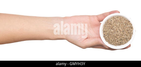 hand with cumin isolated on white background Stock Photo