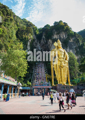 KUALA LUMPUR, MALAYSIA - MAR 1: Tourist and Lord Murugan Statue in front the batu cave entrance on March 1, 2016 Stock Photo