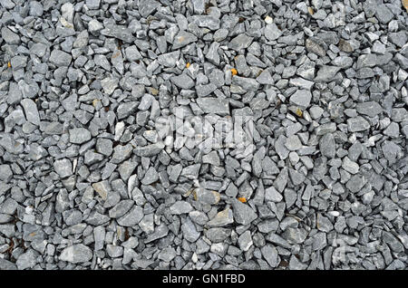 grey produced stone pebbles background texture Stock Photo