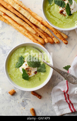 Green summer soup with grissini. Food top view Stock Photo