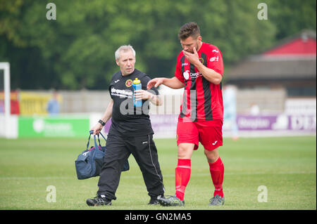 UK. 27th August, 2016. Evo-Stik Division 1 South and West; Winchester FC v Tiverton Town FC. Winchester City's H Neighbour gets treatment for a head injury. Credit:  Flashspix/Alamy Live News Stock Photo