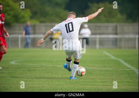 UK. 27th August, 2016. Evo-Stik Division 1 South and West; Winchester FC v Tiverton Town FC. Tiverton Town's Liam Landricome striking from the edge of the box Credit:  Flashspix/Alamy Live News Stock Photo