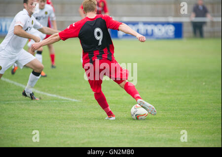 UK. 27th August, 2016. Evo-Stik Division 1 South and West; Winchester FC v Tiverton Town FC. Winchester's Feeney Fires in a shot from the edge of the box Credit:  Flashspix/Alamy Live News Stock Photo