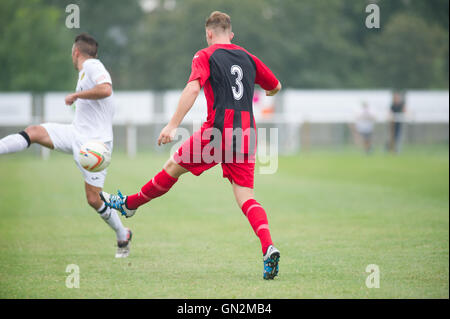 UK. 27th August, 2016. Evo-Stik Division 1 South and West; Winchester FC v Tiverton Town FC. Winchester Town's Hurst with a clearance Credit:  Flashspix/Alamy Live News Stock Photo