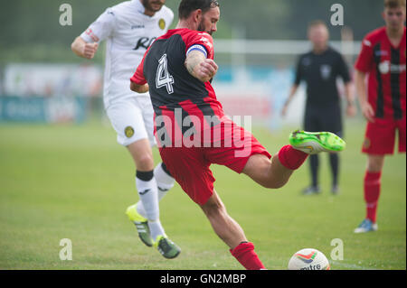 UK. 27th August, 2016. Evo-Stik Division 1 South and West; Winchester FC v Tiverton Town FC. Winchester City  skipper Jamie Brown with a clearance Credit:  Flashspix/Alamy Live News Stock Photo
