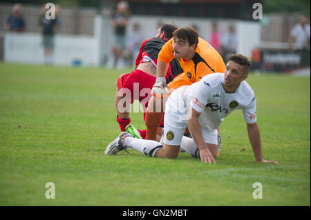 UK. 27th August, 2016. Evo-Stik Division 1 South and West; Winchester FC v Tiverton Town FC. All eyes on the ball as the Winchester City defence clear their lines Credit:  Flashspix/Alamy Live News Stock Photo
