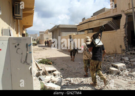 Sirte, Libya. 28th Aug, 2016. Members of the forces loyal to Libya's UN-backed Government of National Accord (GNA) patrol in the coastal city of Sirte, east of the capital Tripoli, Libya, on Aug. 28, 2016. Fierce clashes against the Islamic State (IS) militants in the Libyan city of Sirte killed 18 soldiers and injured another 120 on Sunday, according to Sirte's field hospital. Credit:  Hamza Turkia/Xinhua/Alamy Live News Stock Photo