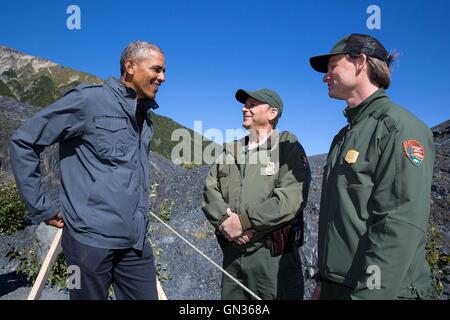 U.S President Barack Obama speaks with park rangers during a visit to the Exit Glacier at Kenai Fjords National Park September 1, 2015 in Kenai, Alaska. Stock Photo