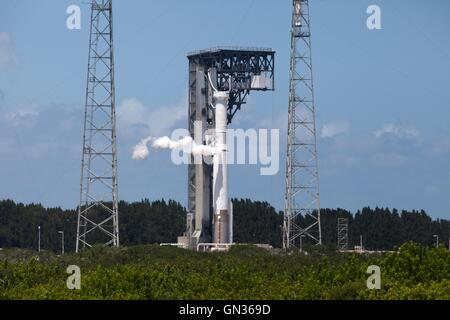 The booster and Centaur upper stage of a United Launch Alliance Atlas V vent gaseous propellant during a test at Space Launch Complex 41 at Cape Canaveral Air Force Station August 25, 2016 in Florida. The rocket will lift the NASA Origins, Spectral Interpretation, Resource Identification, Security-Regolith Explorer, or OSIRIS-REx spacecraft into orbit on September 8, 2016. Stock Photo