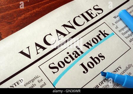 Newspaper with ads social work jobs vacancy. Occupation concept. Stock Photo