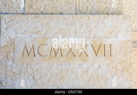 Roman numerals carved on stone wall Stock Photo - Alamy