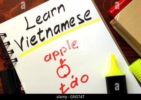 Learn vietnamese written in a notepad.  Education concept. Stock Photo