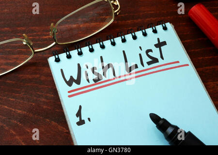 Wish list written on a notepad with marker. Stock Photo