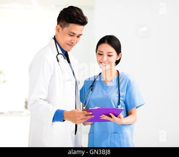 smiling Medical doctors working in the office Stock Photo