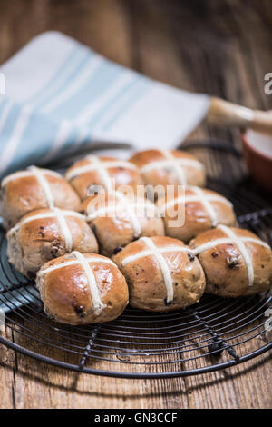 Easter hot cross buns on cooling tray Stock Photo