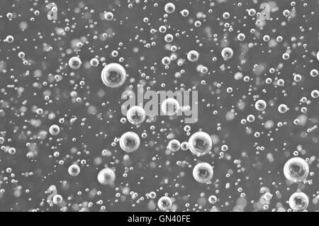 Black-and-white Macro Oxygen bubbles in water, concept such as ecology, environment, clean sea, potable water Stock Photo