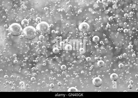 Black-and-white Macro Oxygen bubbles in water, concept such as ecology, environment, clean sea, potable water Stock Photo