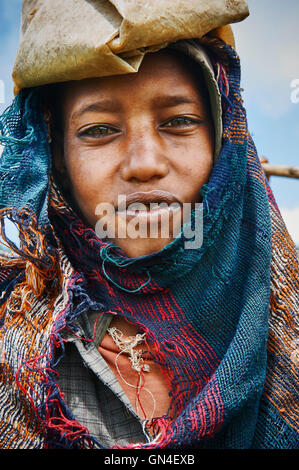 SIMIEN MOUNTAINS NATIONAL PARK, ETHIOPIA - SEP 12, 2013: Yound shepherd in Simien Mountains, Ethiopia, north east of Gondar. Wor Stock Photo