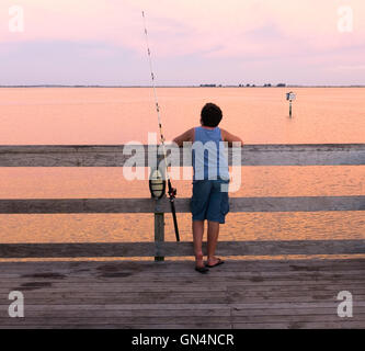 Young boy fishing at the Safety Harbor Marina fishing pier, Florida. Stock Photo