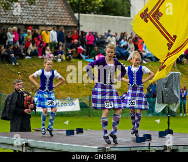 Girls in kilted skirts performing at the Highland Dancing competition, Ceres Highland Games, Ceres, Scotland, United Kingdom Stock Photo