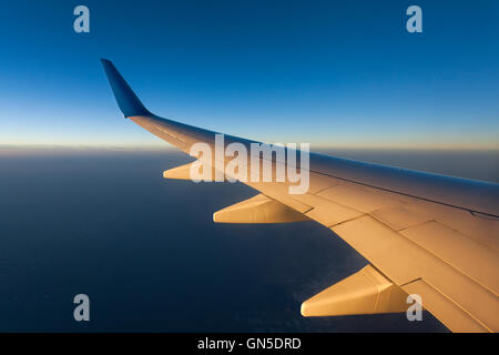 plane wing sunrise Stock Photo