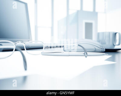 workplace with a laptop, glasses, mug of coffee, pen and paper Stock Photo
