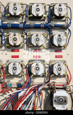 Old electrical metal control panel with switches. Stock Photo