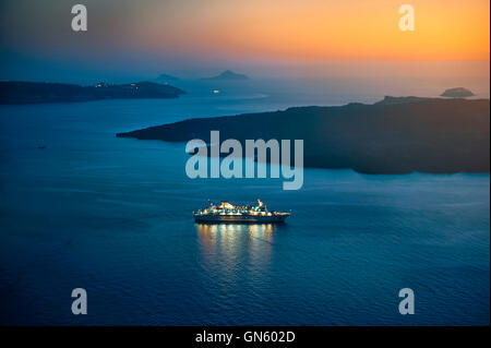 Beautiful landscape with sea view. Cruise liner at the sea near the Nea Kameni, a small  Greek island in the Aegean Sea near San Stock Photo