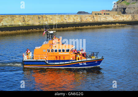 RNLI Life Boat entering Whitby harbour North Yorkshire England UK Stock ...