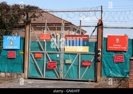 warning and information signs on rear entrance to british army reserve centre in south belfast Stock Photo