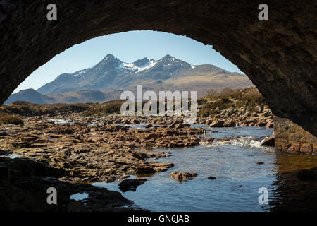 Cuillins of Skye viewed through the arch bridge at Sligachan Stock Photo