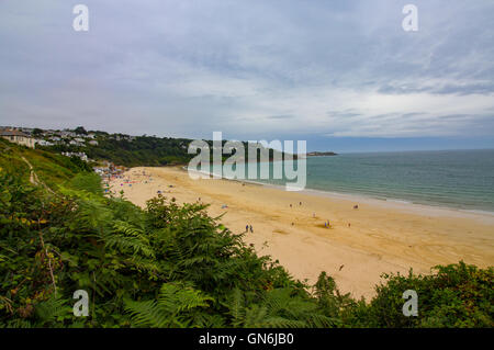 The golden sands at Carbis Bay, Cornwall captured on a moody summers day in the UK. Stock Photo
