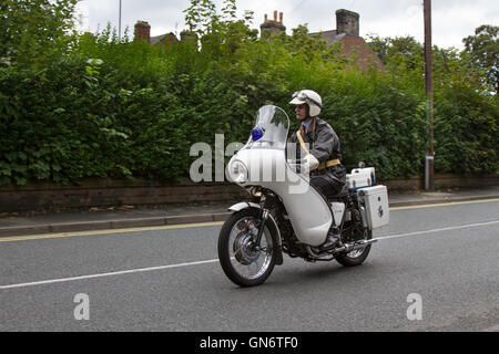 1969 60s Triumph 650cc TR6P Police Motorcycle; White triumph saint Police Motorcycle; Vintage uniformed motorcyclists at the 2017 Ormskirk MotorFest on Sunday 27 August. 300 vintage, classic motorcycles from all eras of motoring lined up on town centre streets for people to admire. Thousands of people attended Ormskirk for this fantastic free family event to admire the fabulous range of vehicles. Stock Photo