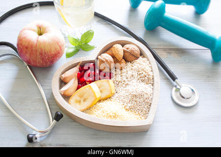 Healthy food in heart and water diet sport lifestyle concept Stock Photo