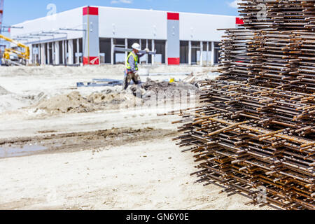 Spikes of rebar grid, reinforcing mesh, steel bars stacked for construction. Stock Photo