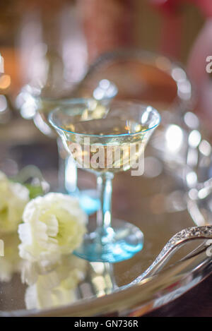 Champagne glass on silver tray Stock Photo