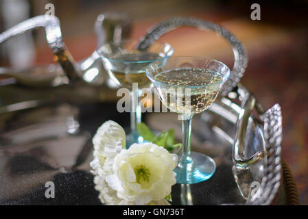 Champagne glasses on a silver serving tray Stock Photo