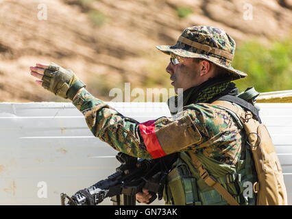 soldier in uniform with weapon on a mission Stock Photo