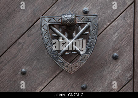 Doorknocker on the wooden gate fixed with rivets in Kokorin Castle in Central Bohemia, Czech Republic. Stock Photo