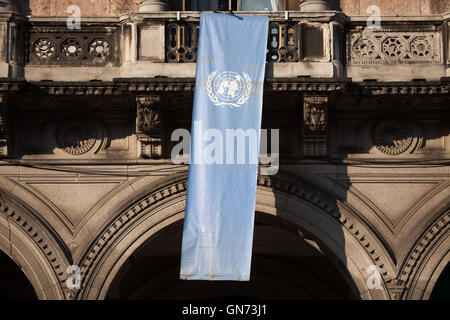 Flag of the United Nations on the balcony in Piazza del Duomo in Milan, Lombardy, Italy. Stock Photo