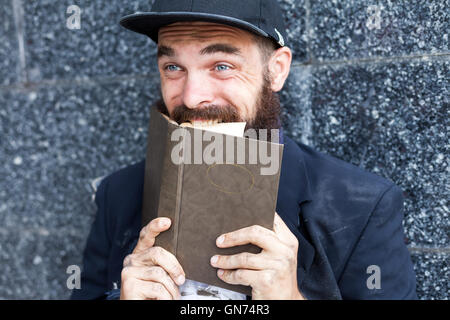 Vagrant with book Stock Photo
