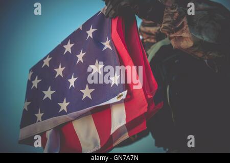 United States of America flag and folded military uniform jacket ...