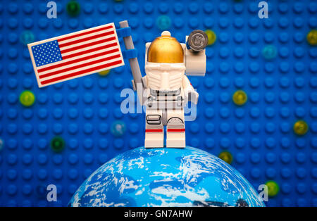 Tambov, Russian Federation - July 06, 2016 Lego spaceman minifigure with American flag stay on planet. Stock Photo