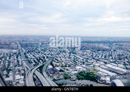 New York City,NY NYC Queens,borough,LaGuardia Airport,LGA,approach,aircraft,in flight,aerial view,descent,highway,skyline,NY160714001 Stock Photo