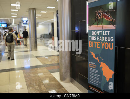 Sign in airport (Atlanta) warning travelers of the Aedes aegypti mosquito and Zika virus Stock Photo