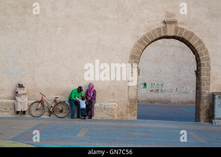 Essaouira, Morocco.  Family in the Place Moulay Hassan, late Afternoon. Stock Photo
