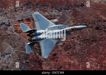 A McDonnell-Douglas F-15C Eagle (78-538), from the 144th Fighter Wing, California Air National Guard Base in Fresno, flies low level through the Jedi Transition, R-2508 complex, Star Wars Canyon / Rainbow Canyon, Death Valley National Park, California, Un Stock Photo